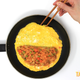 Illustration for article titled Make omurice, the irresistible Japanese ketchup fried rice omelet—wait, come backem/em